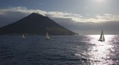 2009 Rolex Middle Sea Race - fleet passing Stromboli - Photo Credit to Kurt Arrigo/Rolex