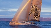 INVESTEC LOYAL catches the sunset off Tasman Island - Photo credit Rolex  Daniel Forster