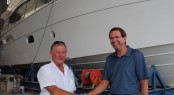 R Marine NZ dealer principal Bruce McGill is congratulated by Riviera CEO John Anderson on ordering the first 75 Enclosed Flybridge bound for New Zealand