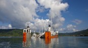 Dockwise Yacht Transport&acirc;��s (DYT) bright orange semi-submersible ship, Super Servant 4, picks up yachts in Golfito, Costa Rica before heading to Brisbane, Australia. (Photo credit Onne van der Wal)