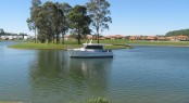 Motor yacht Integrity 320 in the lake at Sanctuary Cove