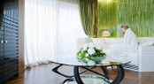 Quinta Essentia Yacht's circular television lounge with spectacular views and sea grass panelling designed by Michela Reverberi
