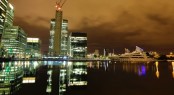 Superyachts anchored in the Thames by night Superyachts anchored in the Thames by night