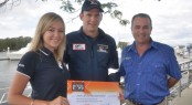 Emma Milne and Steve Sammes present the 2012 Expo donation to Jared Clark from the Westpac Surf Life Saver Helicopter Rescue Service