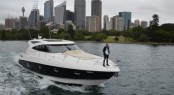 X Factor mentor and judge Ronan Keating stands on the bow of the Riviera 5800 Sport Yacht Buoy Toy
