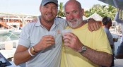 Phaedo's Lloyd Thornburg invites Peter Aschenbrenner to enjoy a celebratory glass of champagne on board to toast the 63ft trimaran, Paradox as winners of the Multihull Class:  Credit: Ocean Images/Team Phaedo