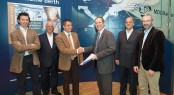Signing of the contract - Jon Eads (left) and Arnauld Devys