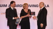 Vienna Eleuteri, VSY Sustainability Project Manager, who received the award by the Italian Ambassador in Monaco, Antonio Morabito, and Riccardo Ballesio, UIM Environmental Working Group Chairman