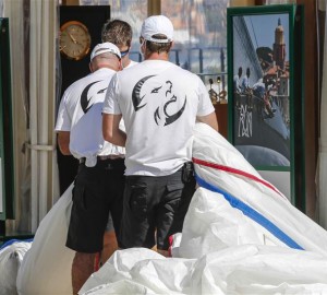 Crew members of Lupa of London yacht during sail measurement on Piazza Azzurra