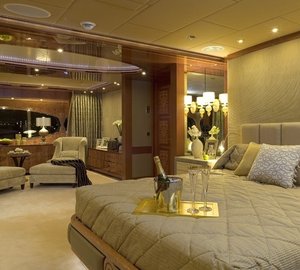 Master suite with large bed and lounge area