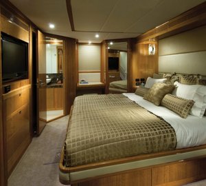 The 75 superyacht  master stateroom  with full beam king-sized bed