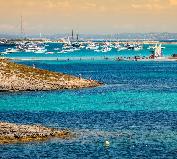 Luxury Yachts In Turquoise Beach Of Formentera