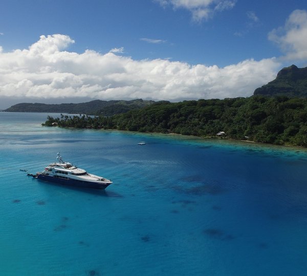 LA DEA II Charter Yacht With Water Toys At Anchor In Tahiti