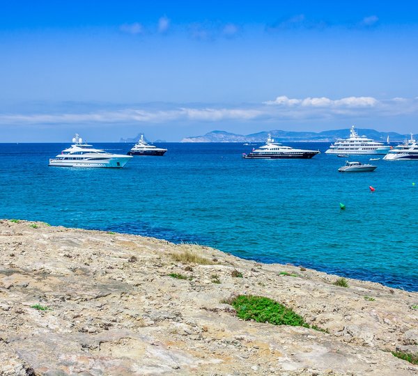 Luxury Yachts In Turquoise Beach Of Formentera Illetes 
