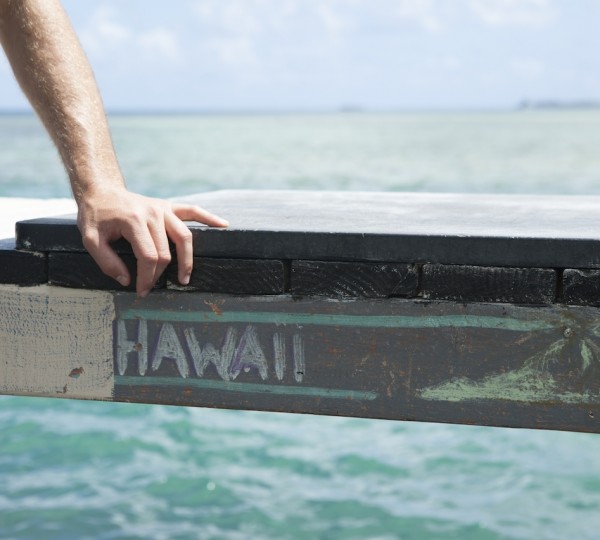 Hands Rest On Dock - Oahu Island - Photo Hawaii Tourism Authority - Daeja Faris