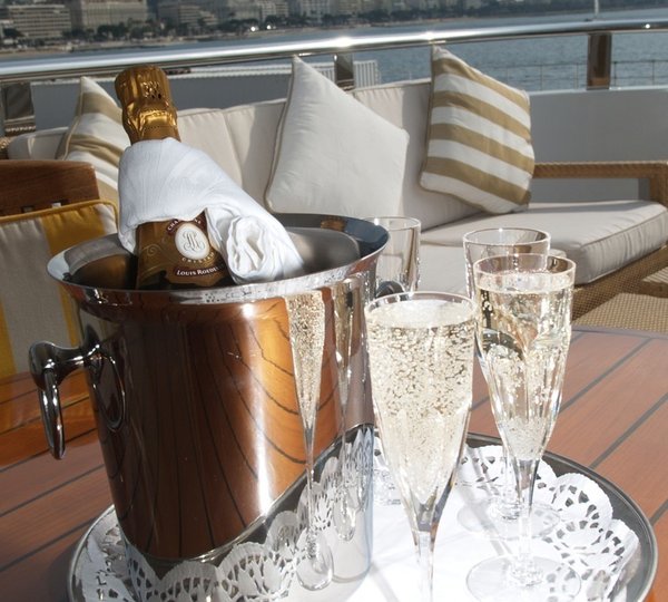 Champaign Glass: Yacht ALASKA OF GEORGE TOWN's Close Up Photograph