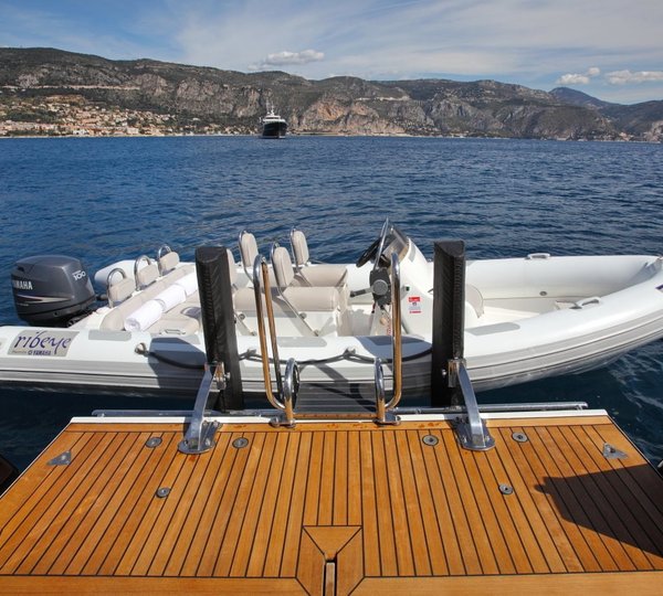 Ship's Tender With Swimming Landing On Board Yacht TUGATSU