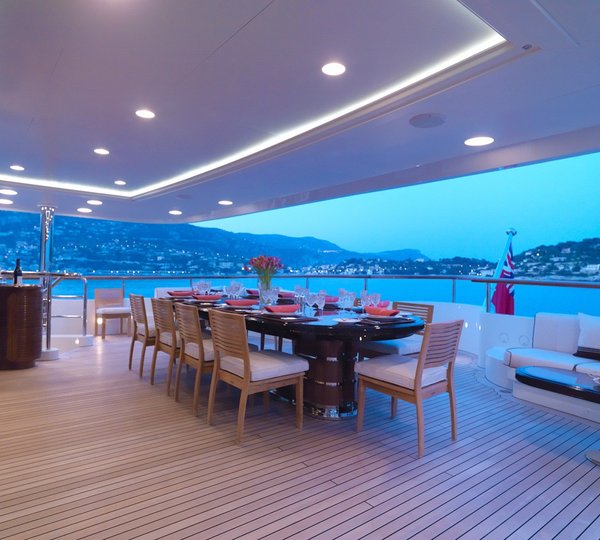 luxury dining set up at sunset on the upper deck outside