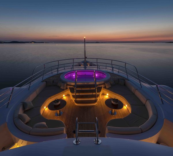 sundeck by night with Jacuzzi lit up