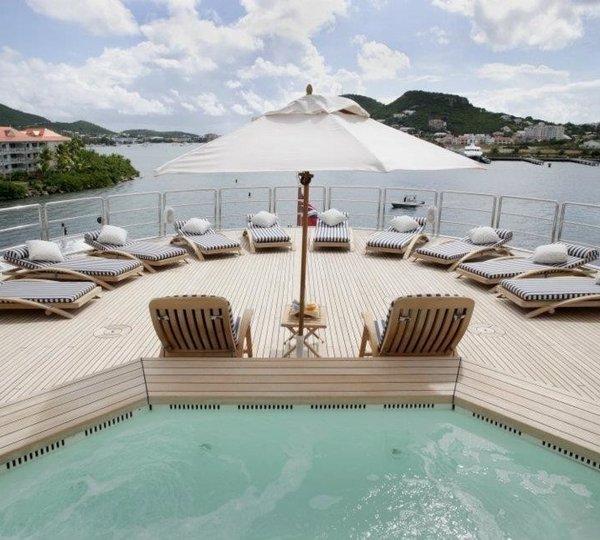 Jacuzzi Pool With Sunshine Lounging On Board Yacht FREEDOM