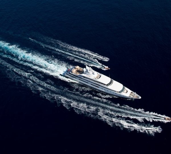 aerial view of the yacht cruising with water toys