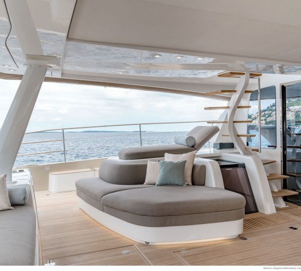 Aft deck lounge seating and stairs to flybridge