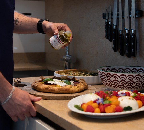 Chef Preparing Meal In The Galley On The Yacht