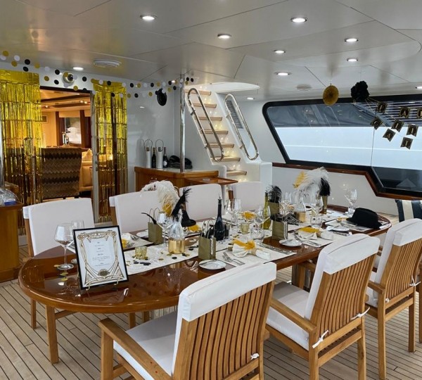 BRIDGE DECK AFT: Magnificent oversized deck with generous seating. The Bridge Deck Aft is enclosed with air-conditioning and panoramic views. Bench seating aft with hi-lo cocktail tables.