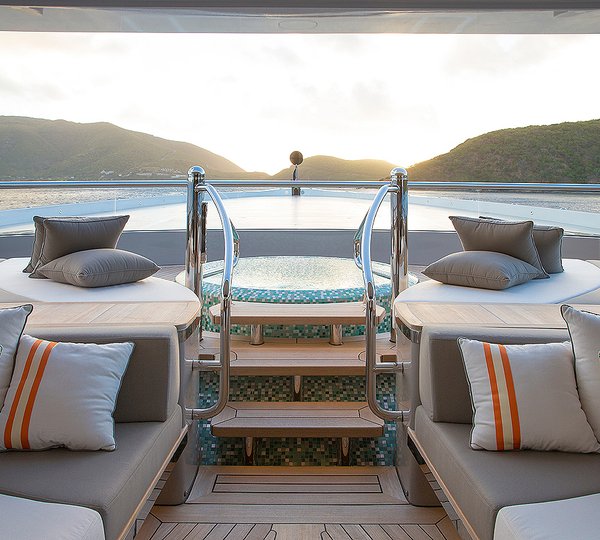 Jacuzzi And Pool With Sunpads