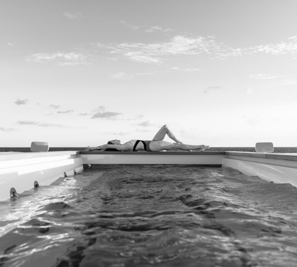 Lady Sunbathing At The Superyacht Pool