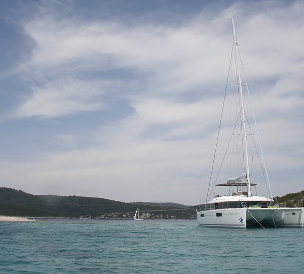 Lagoon Sailing Yacht EAGLE OF NORWAY - Anchored In A Bay