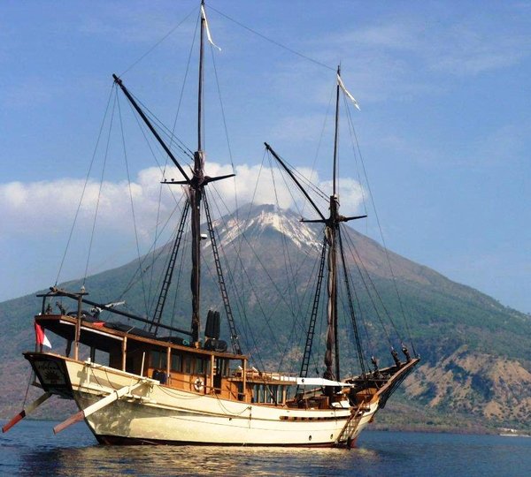Silolona Anchored In Front Of Active Volcano