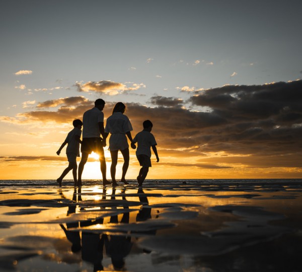 Family On A Beach - Sunset
