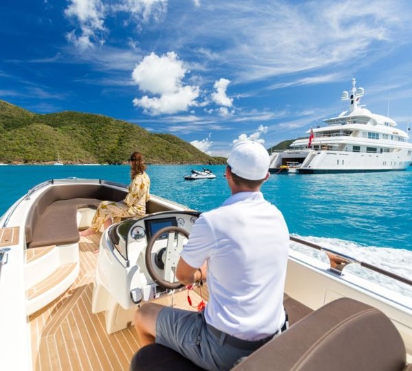 From Tender Looking At The Yacht With Water Toys