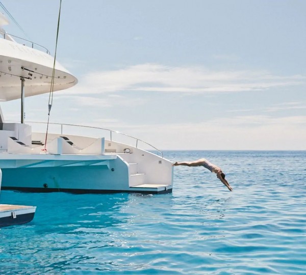 Jumping Into The Water Off The Yacht