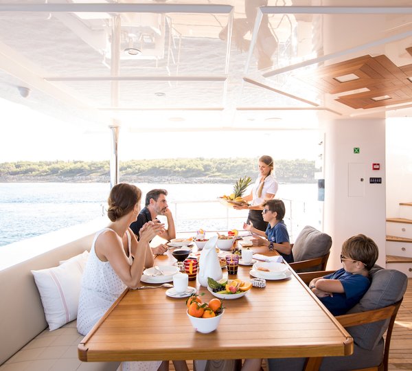 Lifestyle Dining With Family On Yacht
