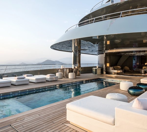 Pool With Seating And Sunbathing Area