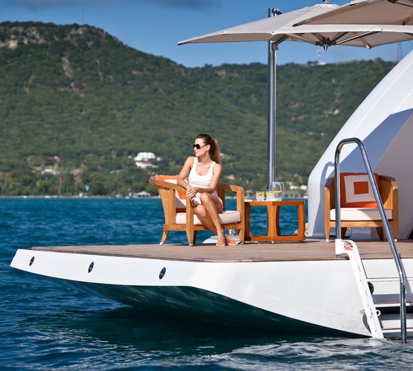 Relaxing Close To Water On Beach Club