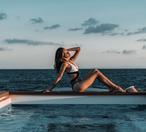 Sunbathing Next To The Pool On A Superyacht