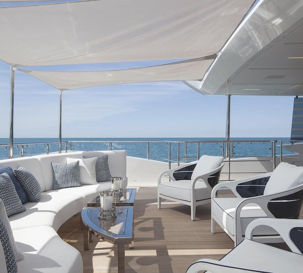 Upper Deck Aft Seating And Coffee Tables On The Outside