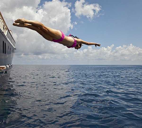 Woman Dive Aboard Yacht SEAWOLF