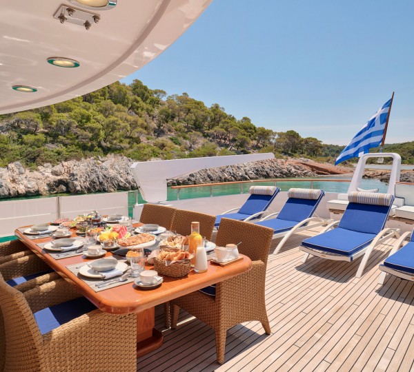 Upper deck dining and sun beds