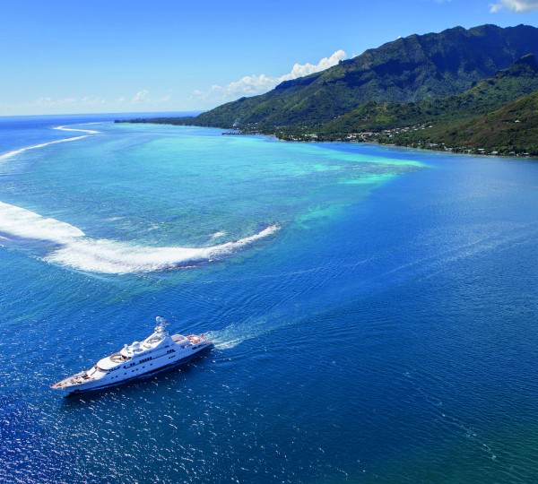 GRAND OCEAN EX GOLDEN ODYSSEY II Running Aerial Shot in Tahiti, South Pacific