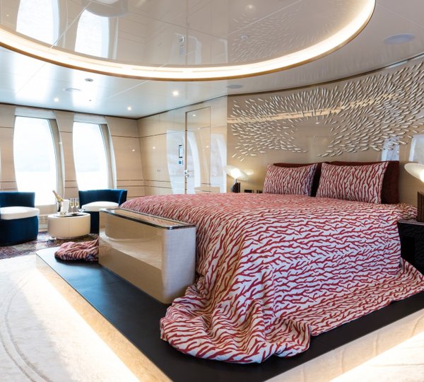 Master Suite With Beautiful Bedding And Seating Area