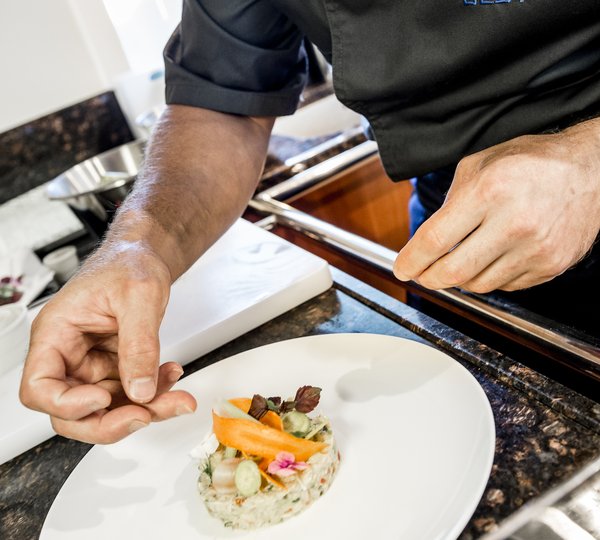 Chef Preparing Gourmet Meal For Guests