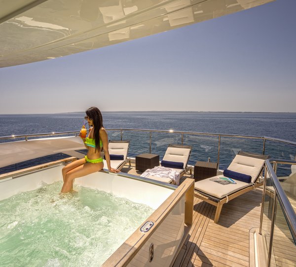 Enjoying A Cocktail By The Jacuzzi