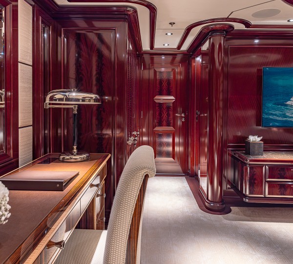 Rock It King VIP Guest Suite Port Aft - Desk And TV Credit Yachting Image