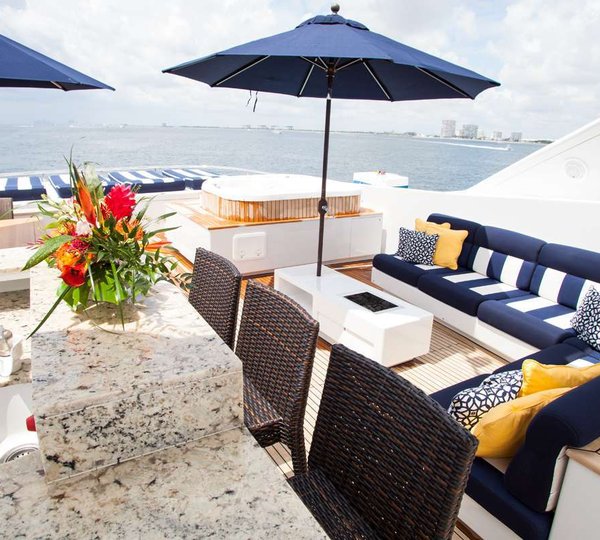 Sun Deck Jacuzzi And Seating Area With A Bar