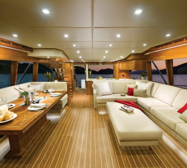 The 75 superyacht aft galley and saloon with L-shaped lounge