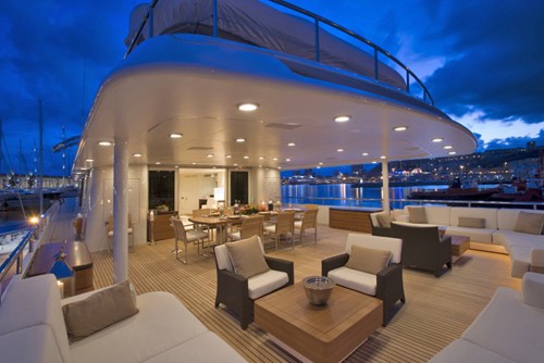 aft deck dining and seating area after sunset